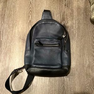 COACH one shoulder sling backpack.